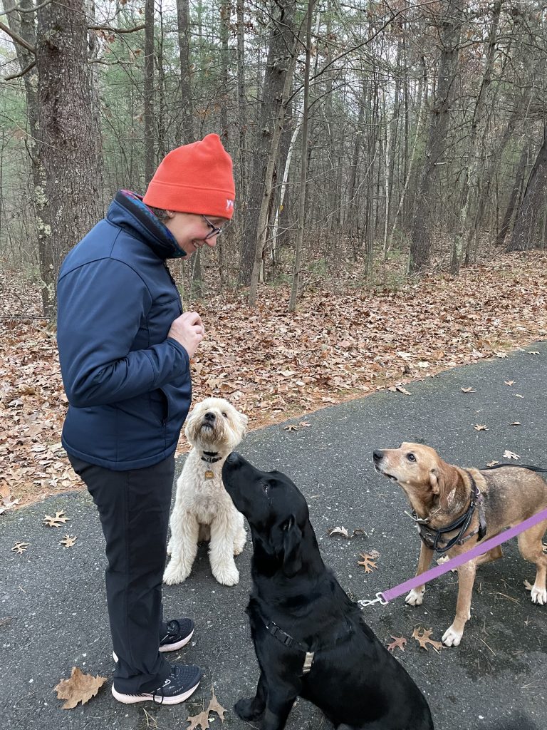 Kim with neighborhood dogs
