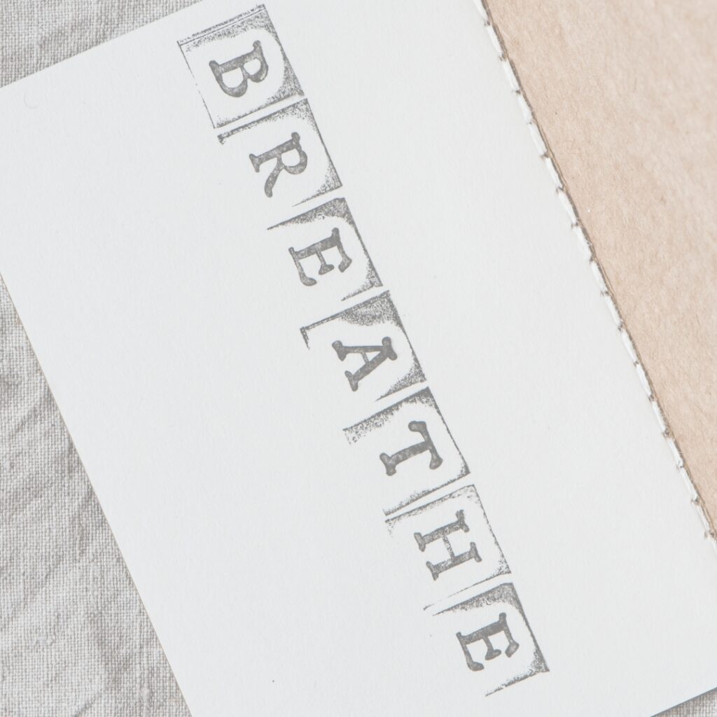 higher ed admins coach's paper reads "breathe"